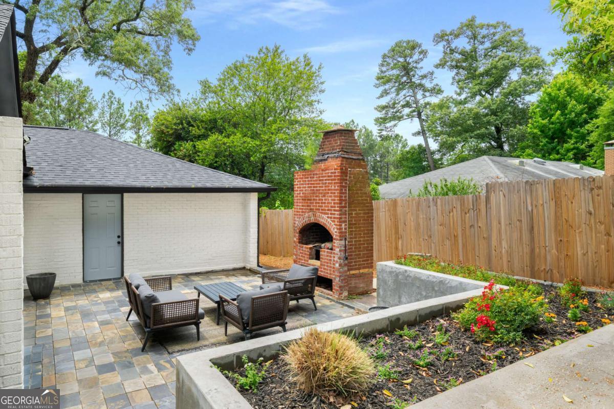 3154 North Druid Hills Road Decatur, GA 30033 - Photo 15 of 84 a view of backyard with outdoor seating and green space