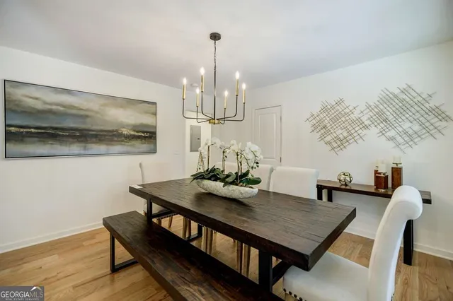 a kitchen with stainless steel appliances granite countertop wooden floors and sink
