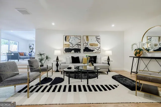 a living room with furniture and a large window