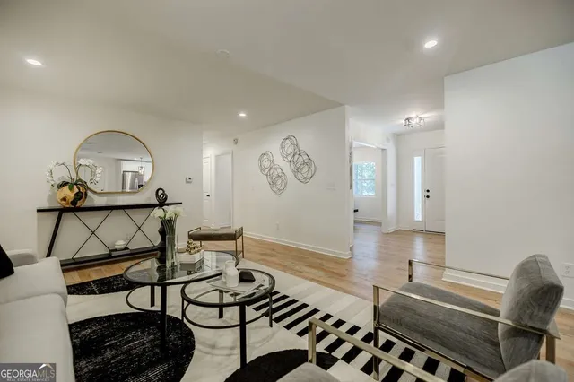 a view of an empty room with wooden floor