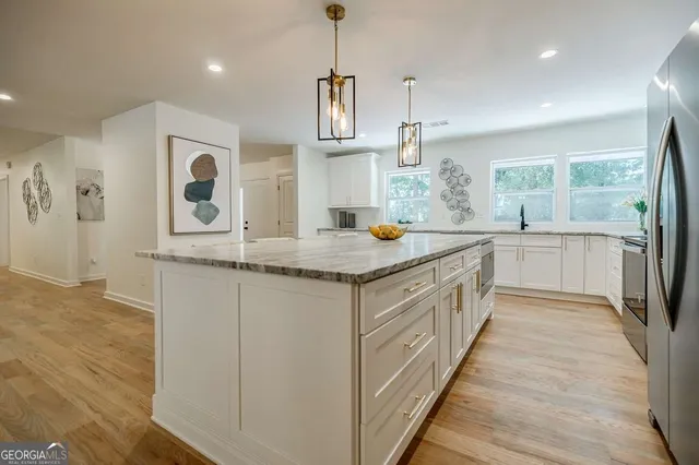 a bedroom with bed and window