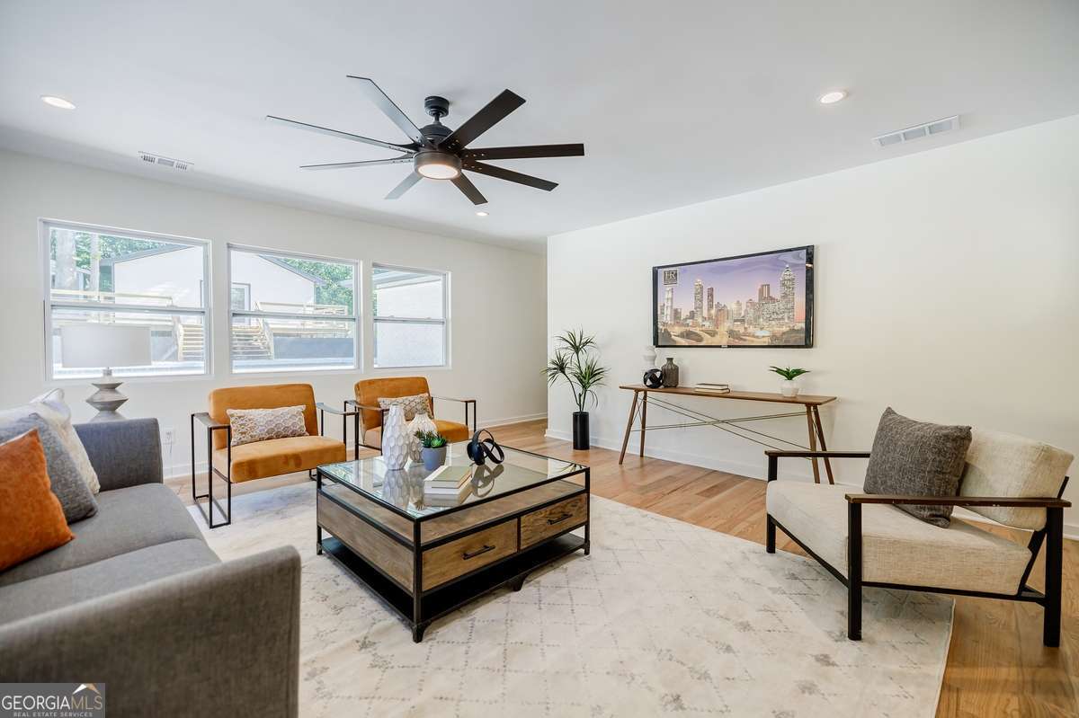3154 North Druid Hills Road Decatur, GA 30033 - Photo 45 of 84 a living room with furniture and a large window