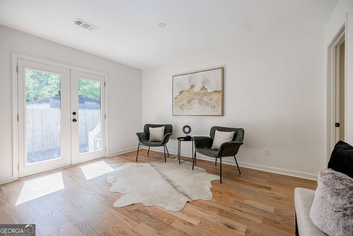 3154 North Druid Hills Road Decatur, GA 30033 - Photo 61 of 84 a view of a livingroom with furniture and wooden floor