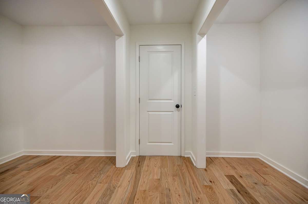 3154 North Druid Hills Road Decatur, GA 30033 - Photo 65 of 84 a view of an empty room and wooden floor