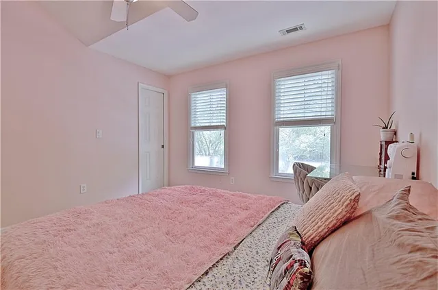 a bedroom with furniture and a chandelier