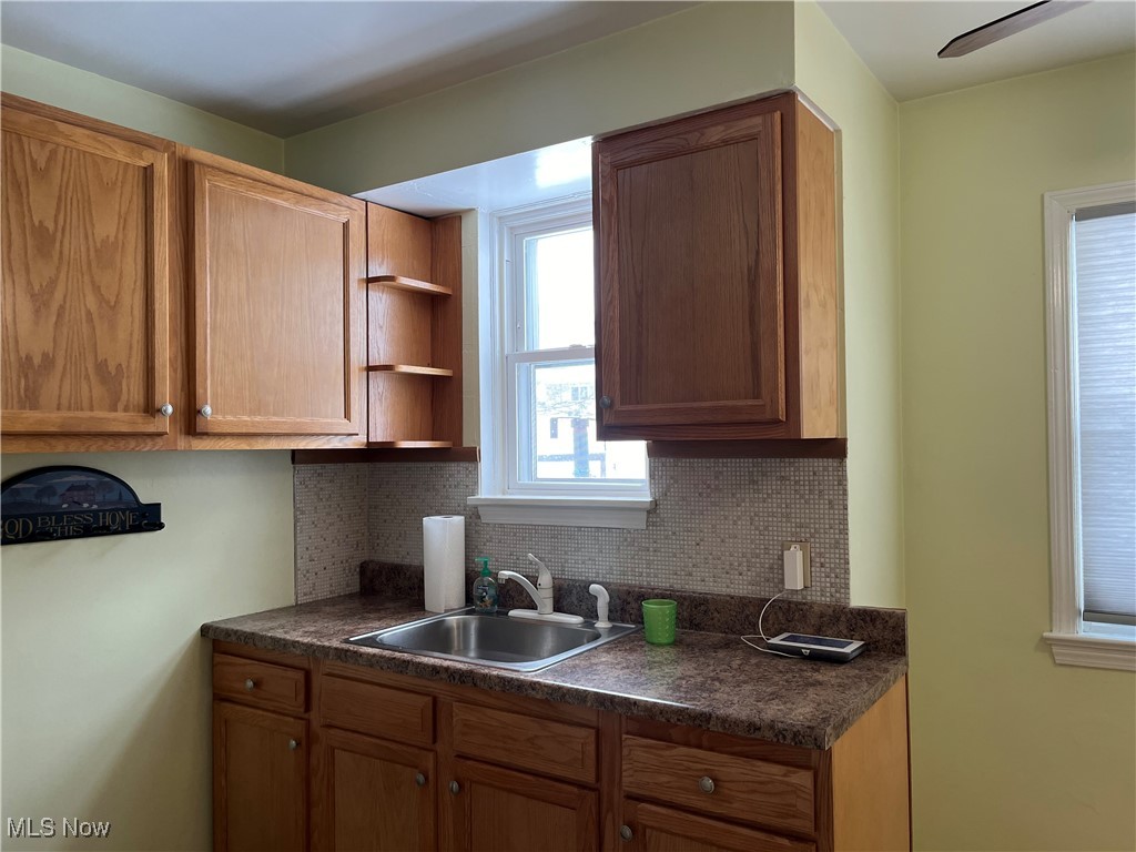 15405 Corkhill Road Maple Heights, OH 44137 - Photo 16 of 50 Kitchen with decorative backsplash and sink