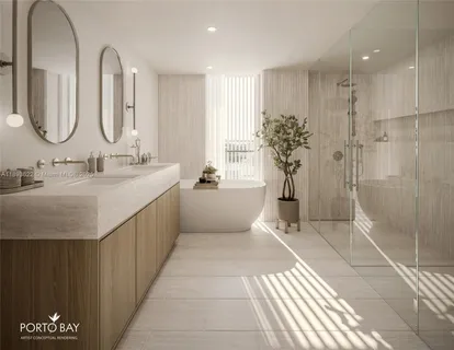 a bathroom with a double vanity sink mirror and shower