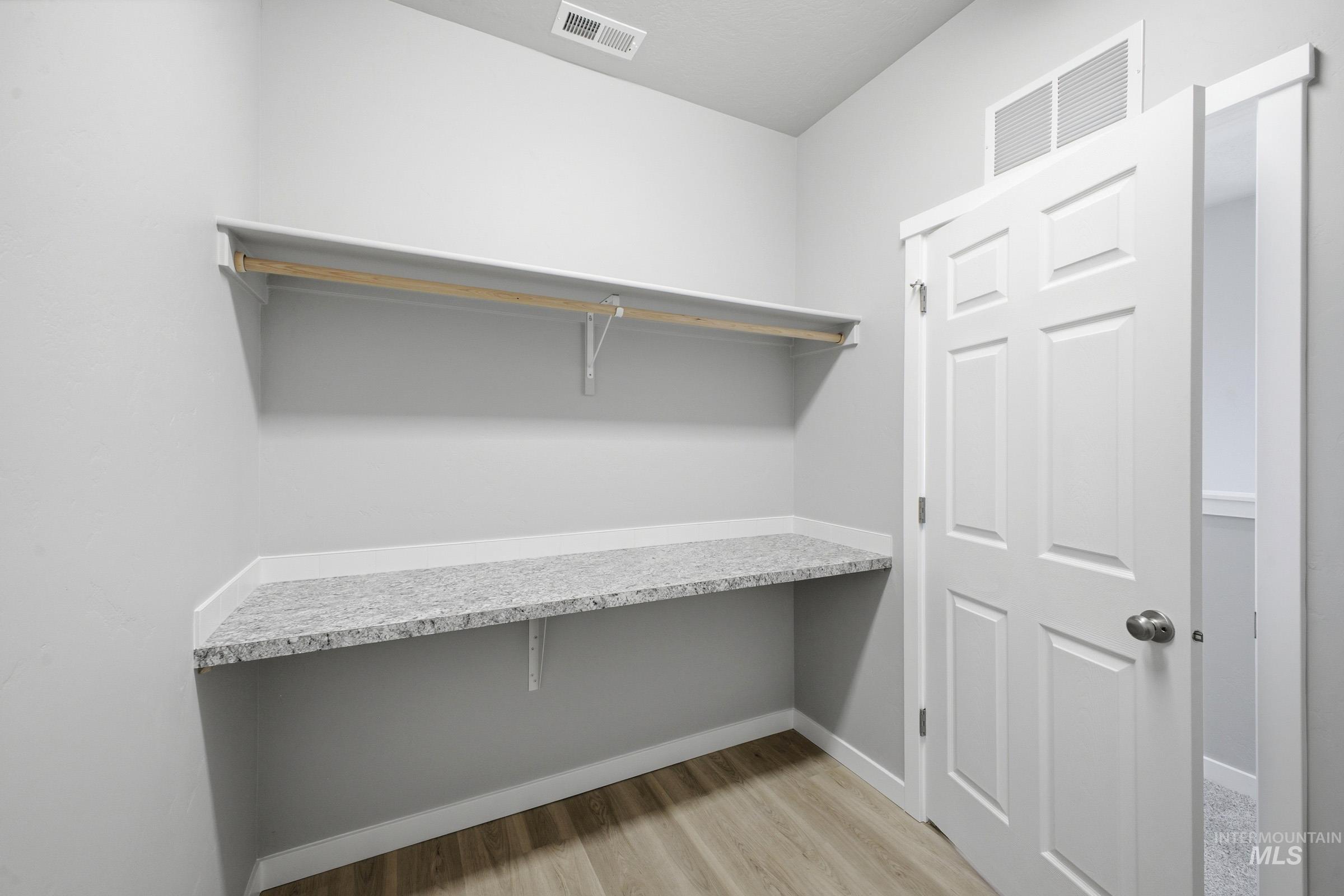 13672 Redway Court Caldwell, ID 83607 - Photo 23 of 34 Walk in closet featuring light wood finished floors