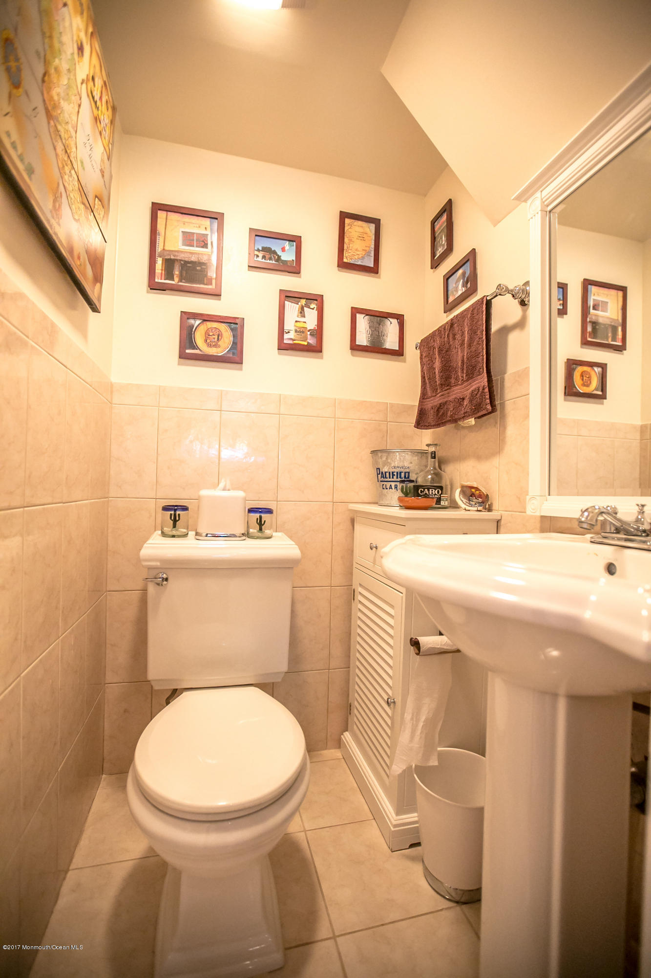 315 Edgemoor Road Middletown, NJ 07718 - Photo 18 of 28 a bathroom with a sink a toilet and mirror