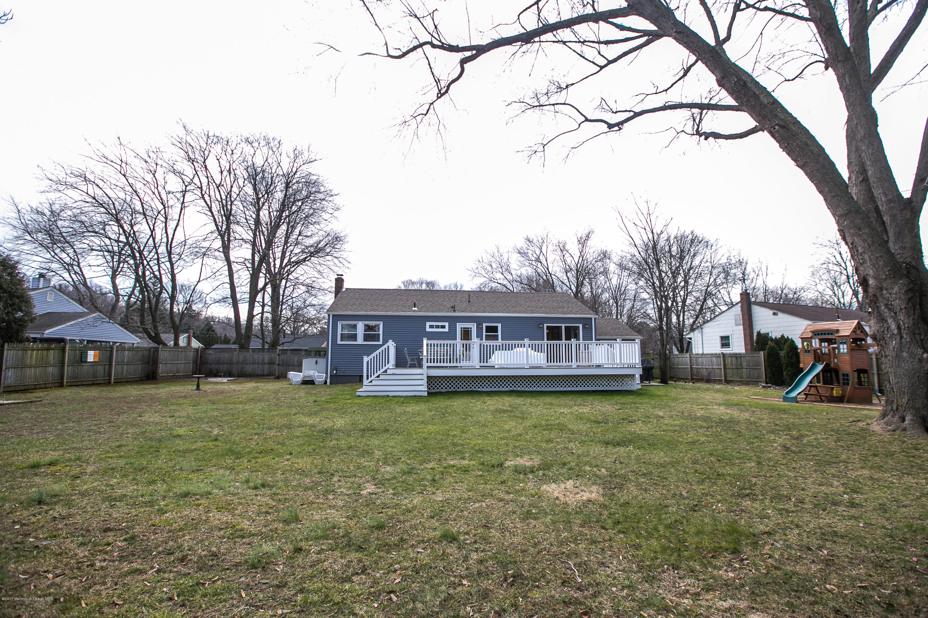 315 Edgemoor Road Middletown, NJ 07718 - Photo 20 of 28 a view of a yard with a house and a large tree