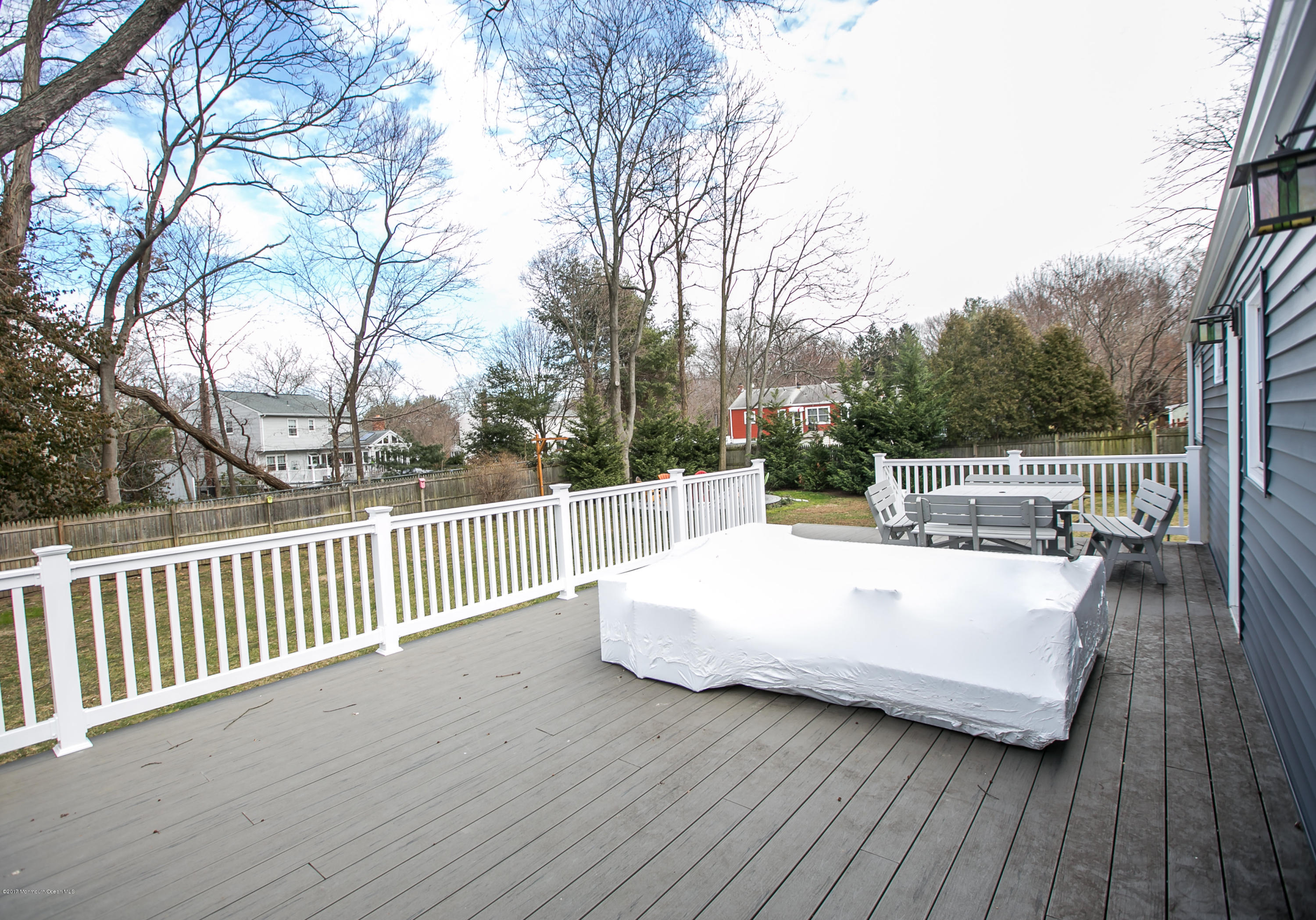 315 Edgemoor Road Middletown, NJ 07718 - Photo 25 of 28 a view of a roof deck with wooden floor and fence