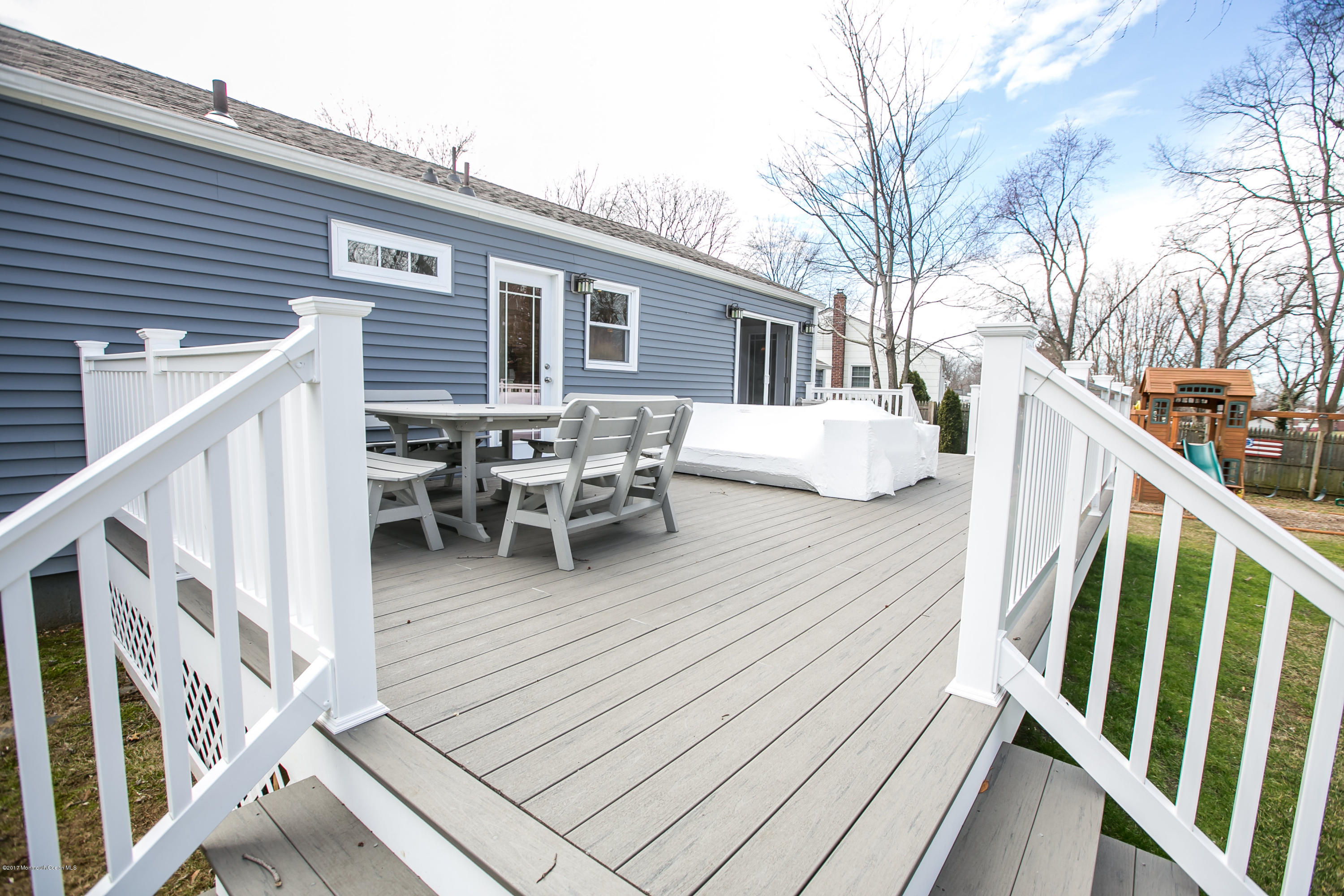 315 Edgemoor Road Middletown, NJ 07718 - Photo 26 of 28 a balcony with wooden floor and furniture