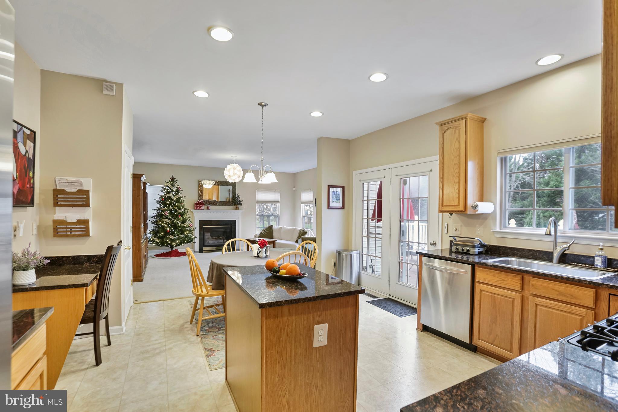 97 Webb Court Frederick, MD 21702 - Photo 12 of 34 a kitchen with stainless steel appliances granite countertop sink stove and refrigerator