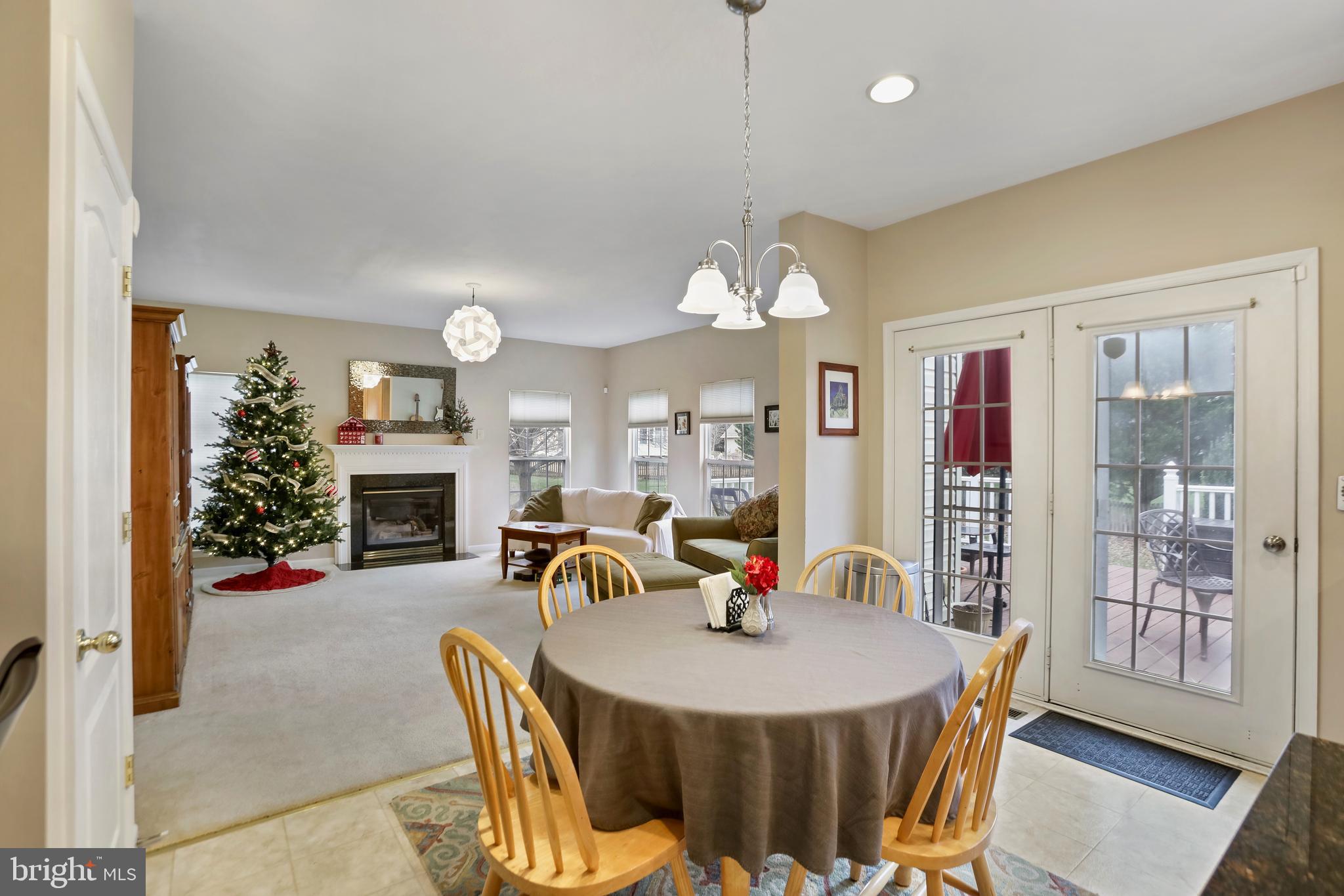 97 Webb Court Frederick, MD 21702 - Photo 13 of 34 a view of a dining room with furniture and chandelier