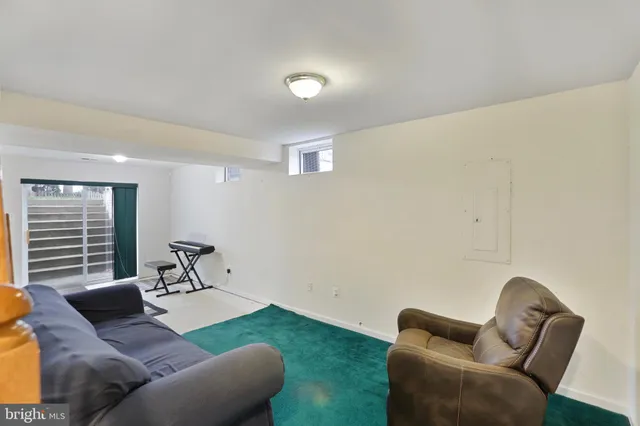 a bathroom with a tub and a window