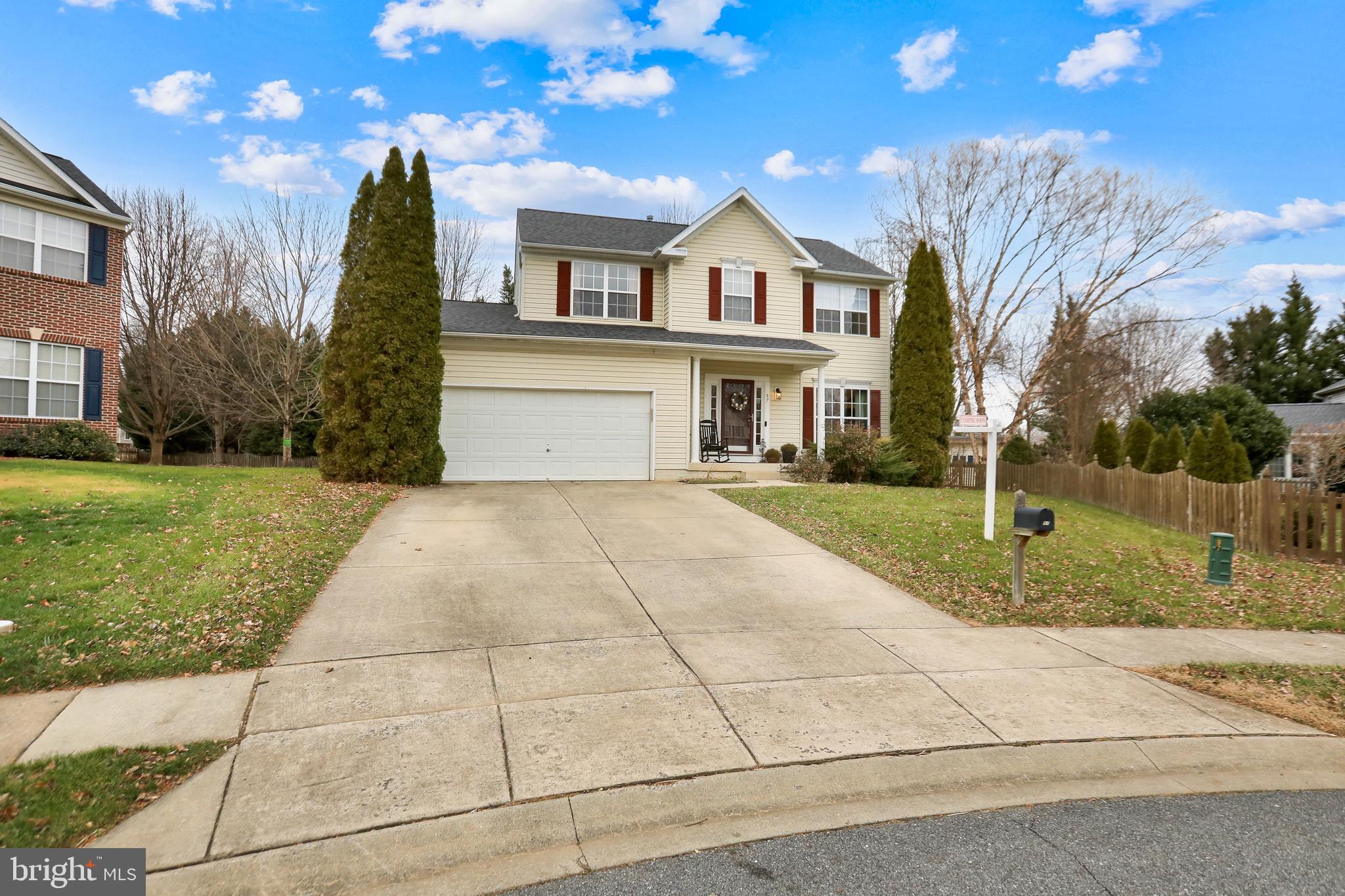 97 Webb Court Frederick, MD 21702 - Photo 2 of 34 a front view of a house with a yard and trees