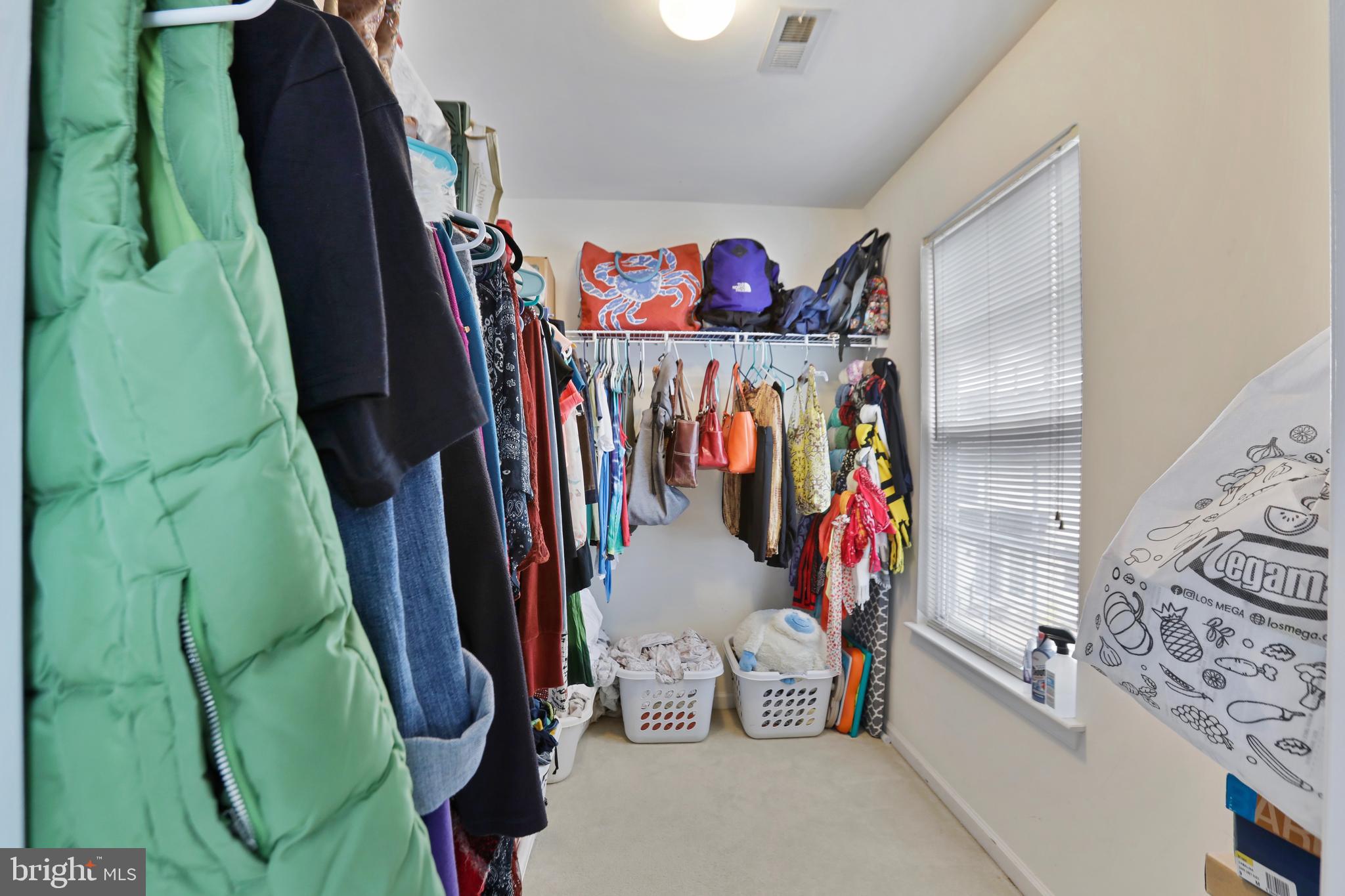 97 Webb Court Frederick, MD 21702 - Photo 25 of 34 a view of walk in closet with clothes