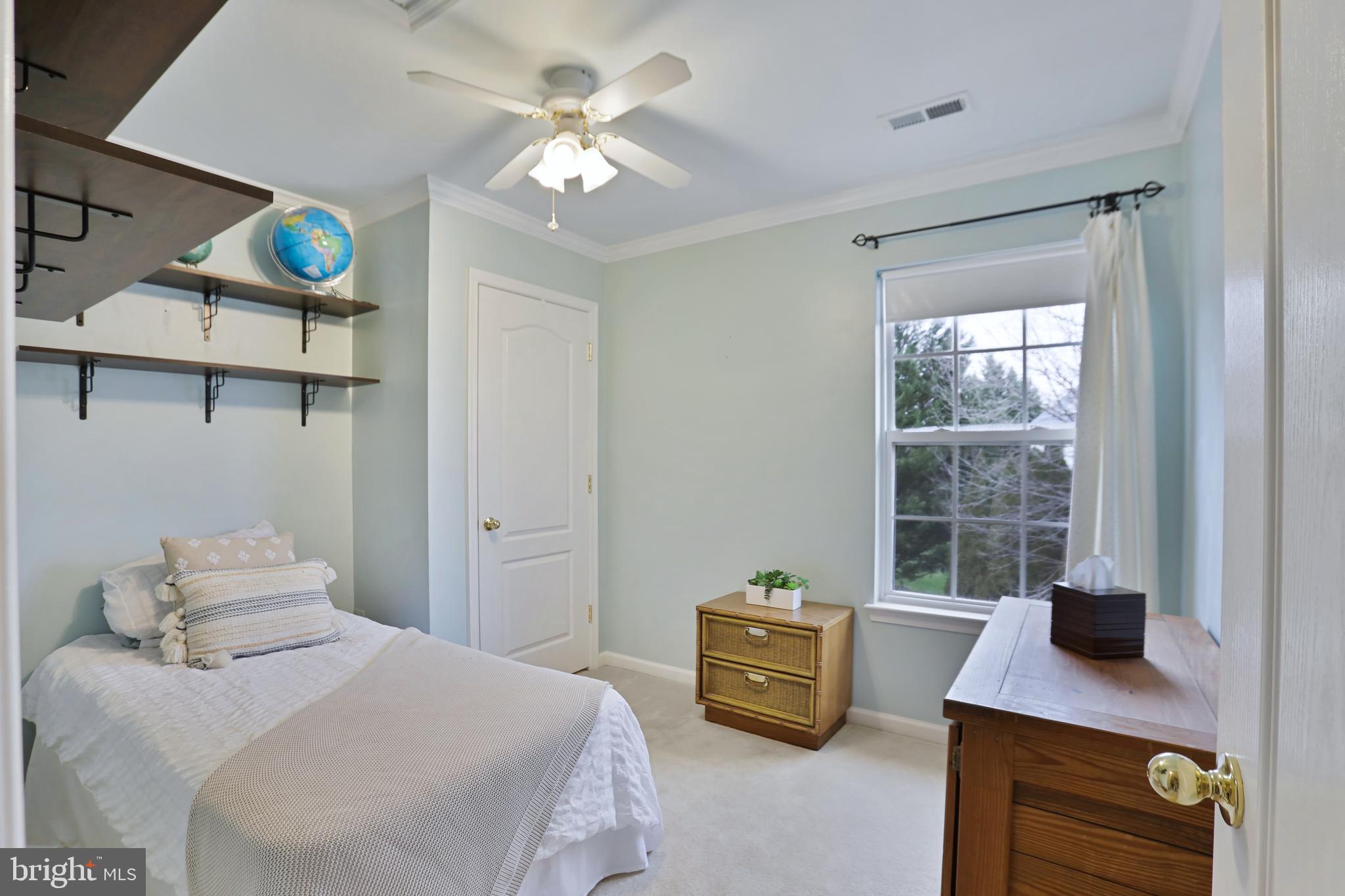 97 Webb Court Frederick, MD 21702 - Photo 28 of 34 a bedroom with a bed window and a table in it