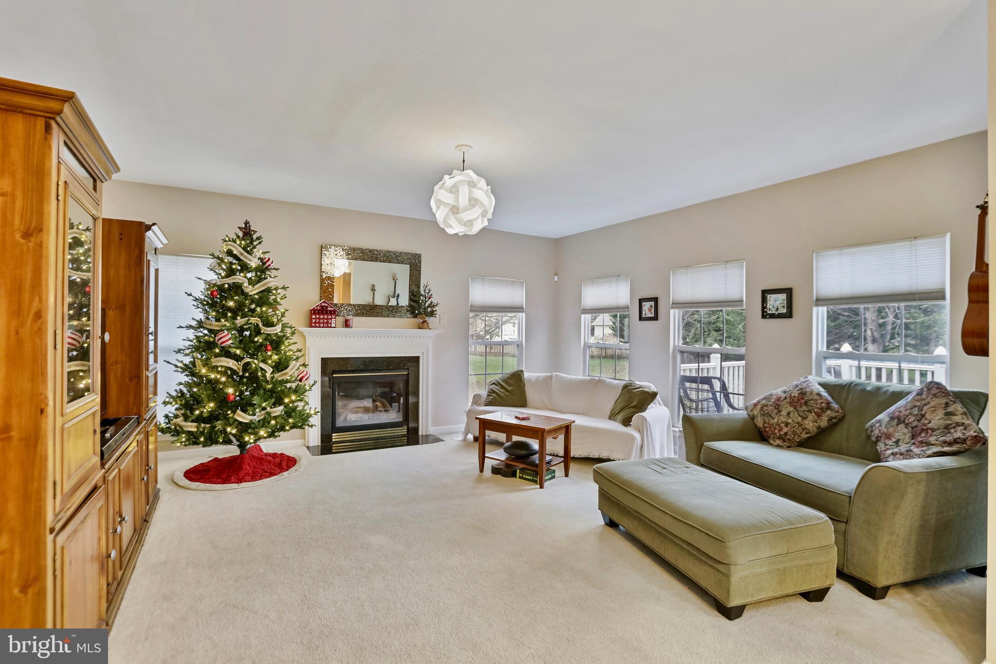 97 Webb Court Frederick, MD 21702 - Photo 4 of 34 a living room with furniture large window and fireplace