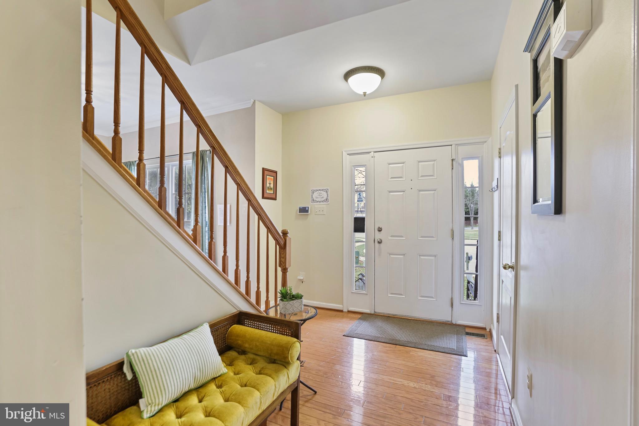 97 Webb Court Frederick, MD 21702 - Photo 6 of 34 a view of a hallway with wooden floor and staircase