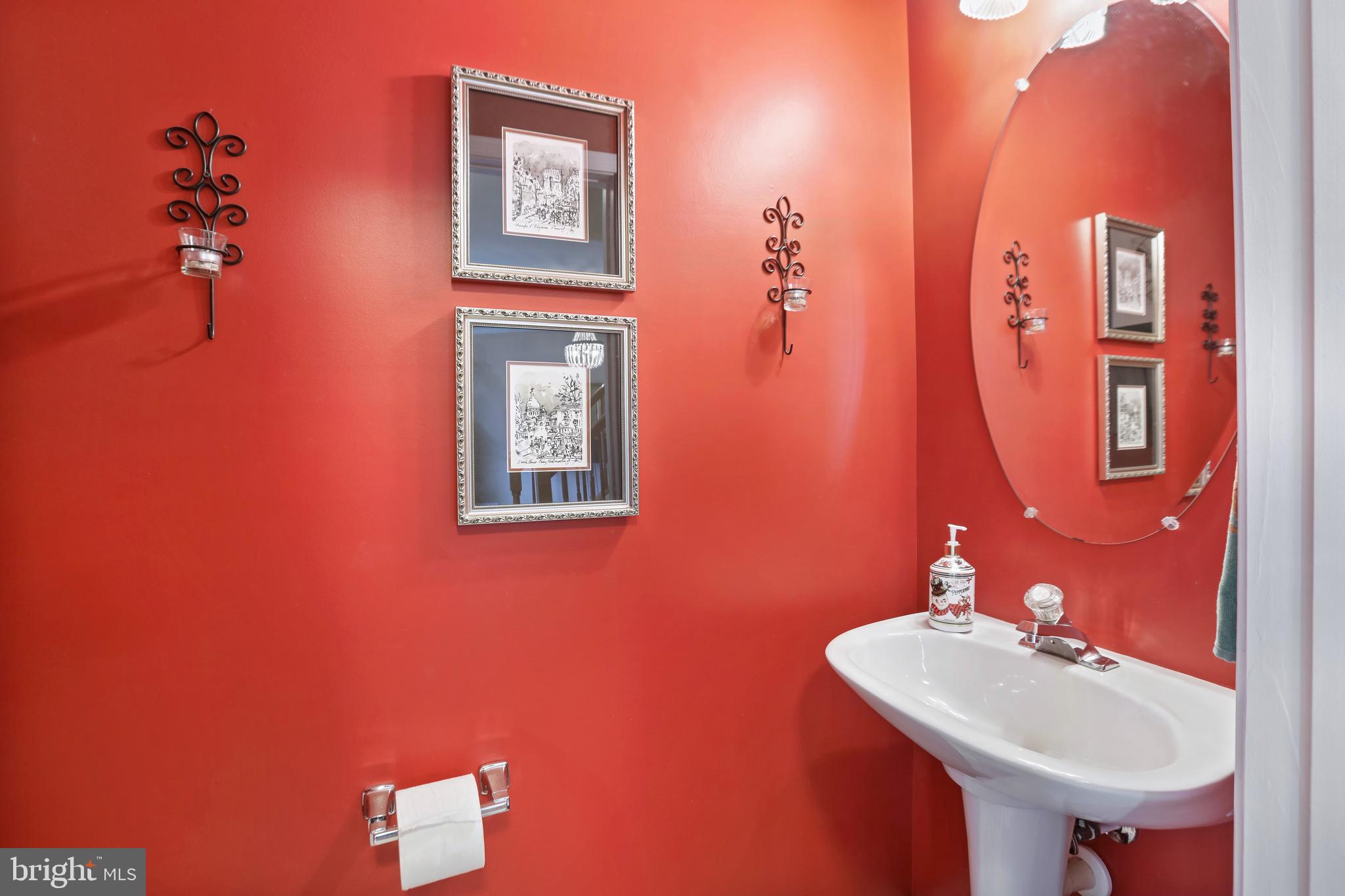 97 Webb Court Frederick, MD 21702 - Photo 8 of 34 a bathroom with a sink and a mirror