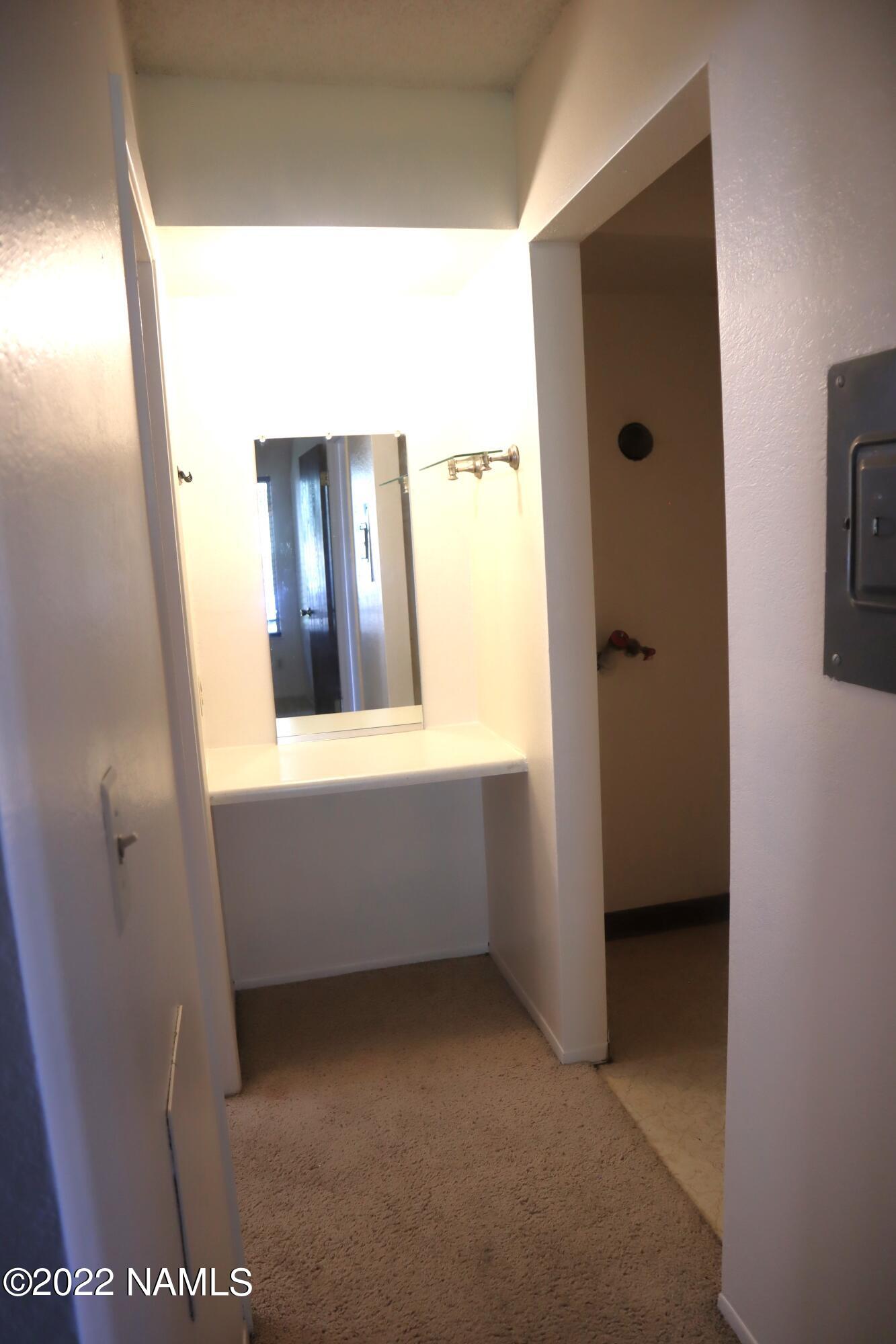 1200 South Riordan Ranch Street, Unit 79 Flagstaff, AZ 86001 - Photo 14 of 23 Hall to bath