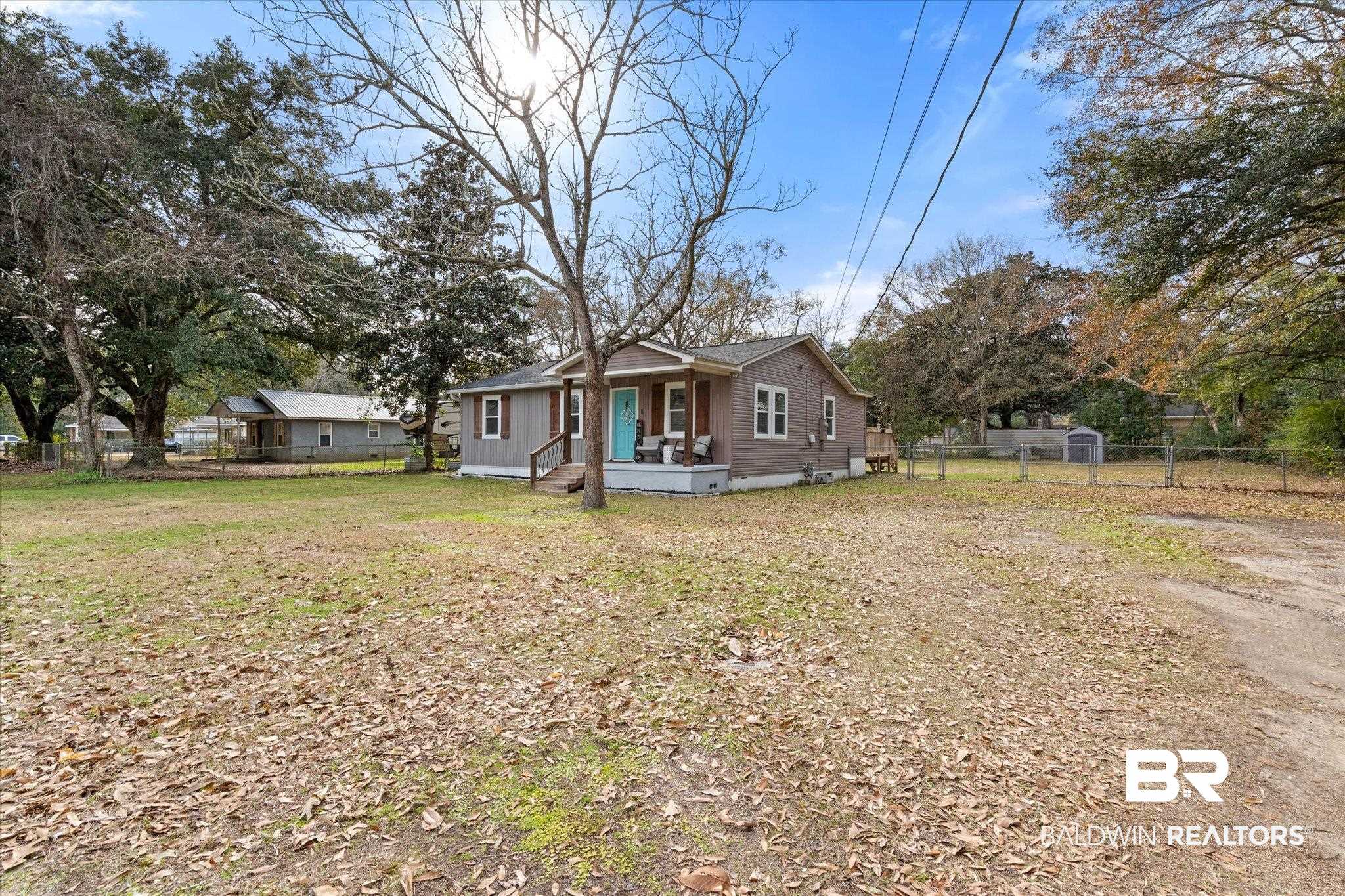 419 Pierce Street Saraland, AL 36571 - Photo 21 of 21 View of front facade featuring a front yard