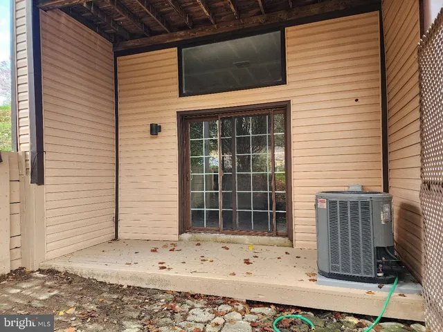 a view of a entryway door front of a house