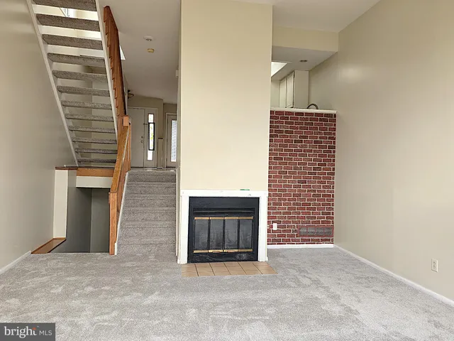 a view of an empty room and stairs