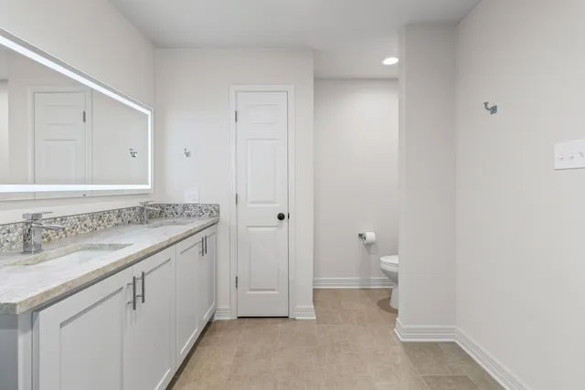 a bathroom with a sink and a toilet