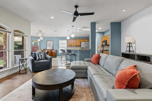 a living room with furniture and a large window
