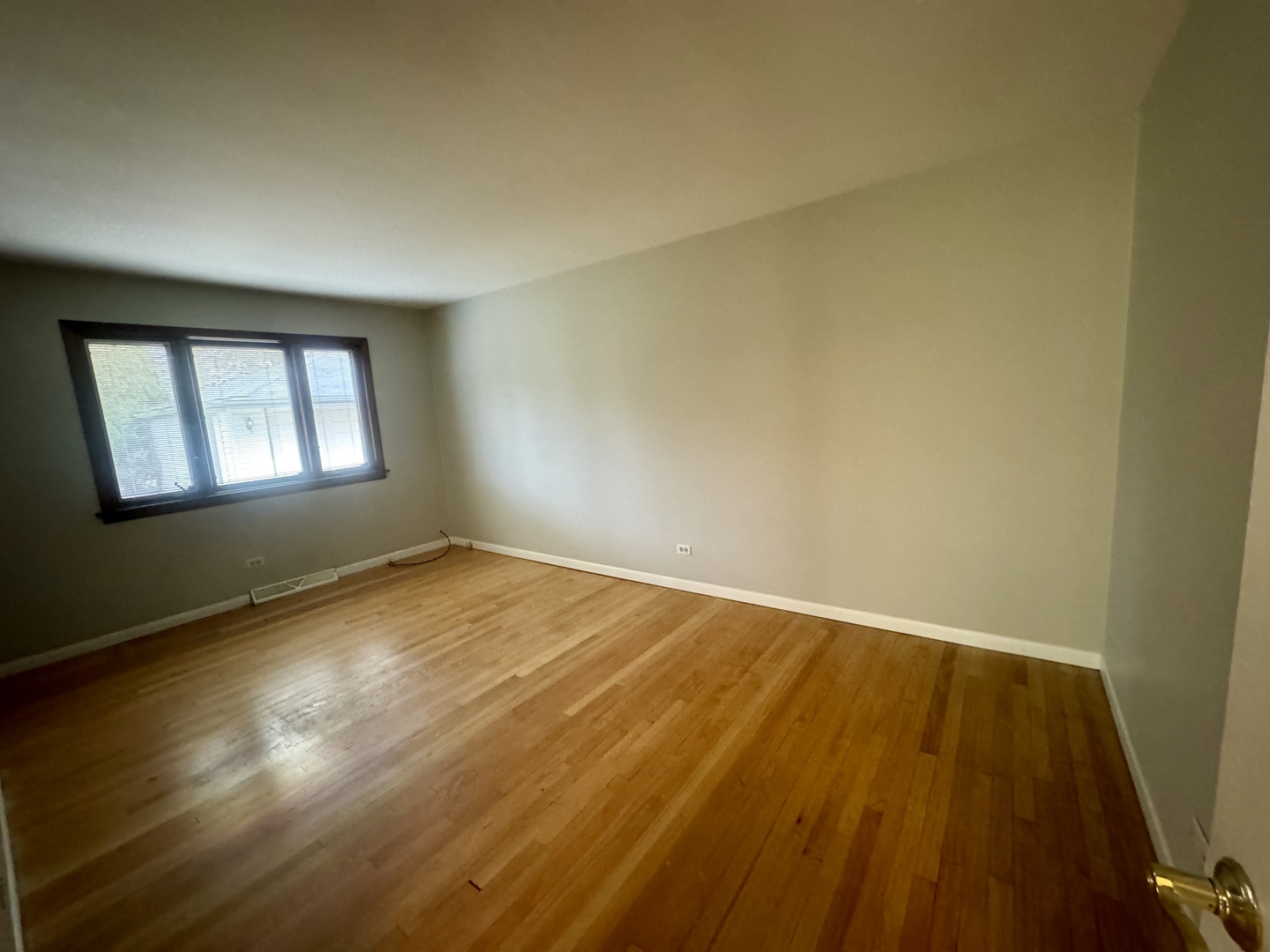 141 Warren Avenue Bloomingdale, IL 60108 - Photo 8 of 22 a view of empty room with wooden floor and fan