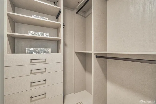 a bathroom with a bathtub a sink a mirror and a shower