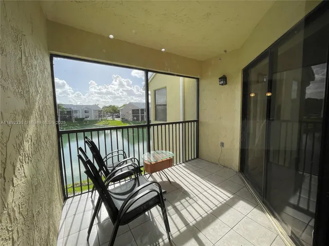 a view of a balcony with furniture