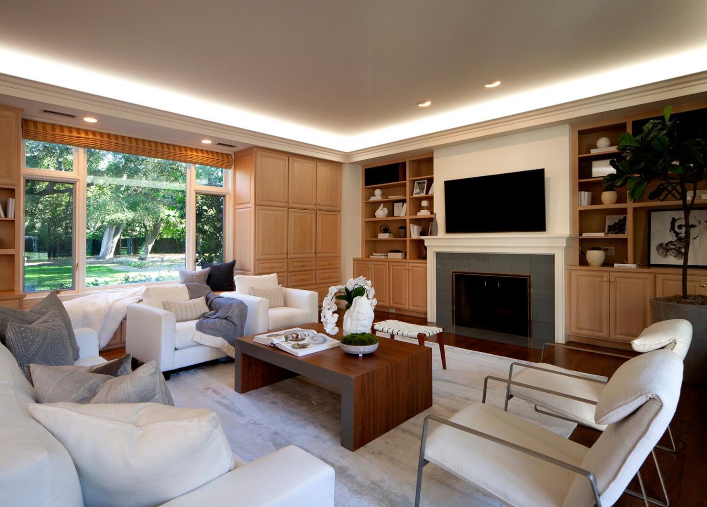 191 Britton Avenue Atherton, CA 94027 - Photo 12 of 23 a living room with furniture a fireplace and a flat screen tv