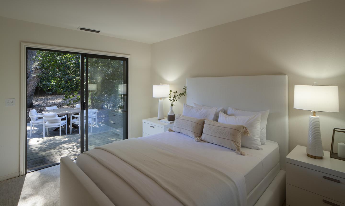 191 Britton Avenue Atherton, CA 94027 - Photo 17 of 23 a bedroom with a large bed and a lamp