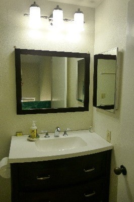 4800 Hanalei Plantation Road, Unit 5A Princeville, HI 96722 - Photo 12 of 20 a bathroom with a sink and a mirror