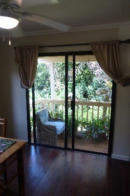 4800 Hanalei Plantation Road, Unit 5A Princeville, HI 96722 - Photo 13 of 20 a view of a room with wooden floor and balcony