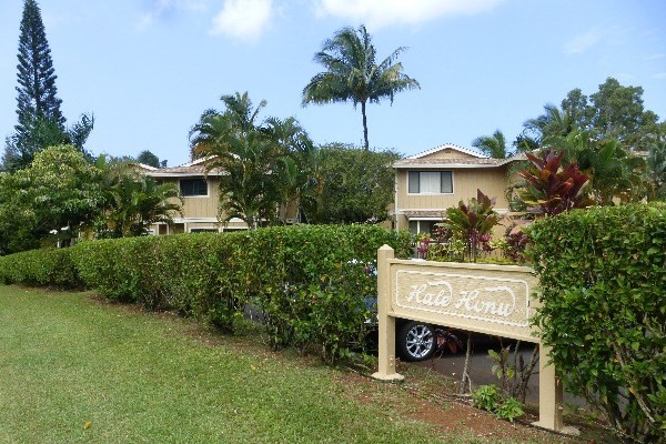 4800 Hanalei Plantation Road, Unit 5A Princeville, HI 96722 - Photo 5 of 20 a view of a house with a yard and potted plants