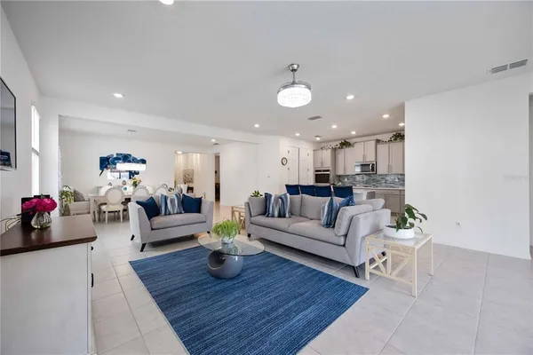 a kitchen with kitchen island granite countertop wooden cabinets and counter space