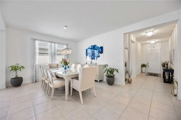 a view of a dining room and livingroom with furniture