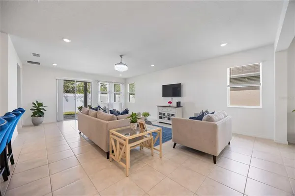 a living room with fireplace furniture and a flat screen tv