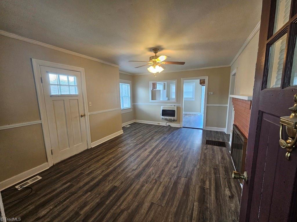 366 Carlton Road Boomer, NC 28606 - Photo 14 of 21 Living room looking into kitchen. Propane wall unit for additional heat