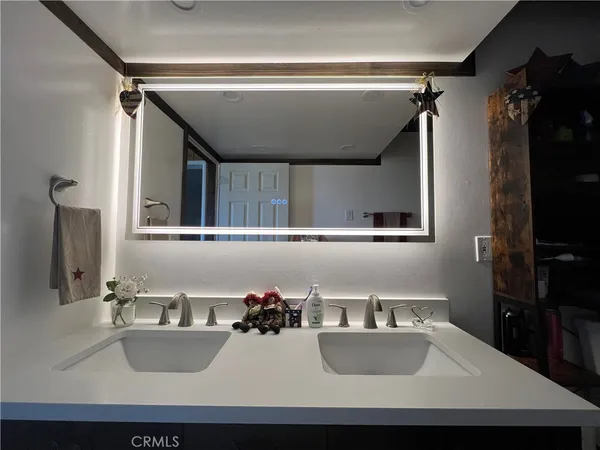 a view of a dining room with a table and chairs