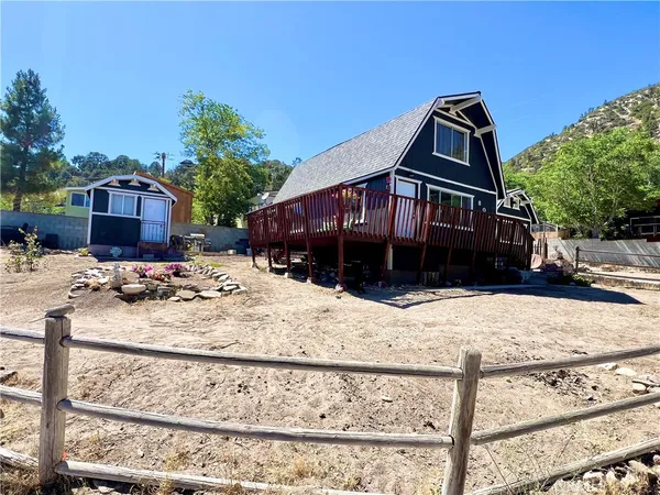 a view of a house with snow on the road