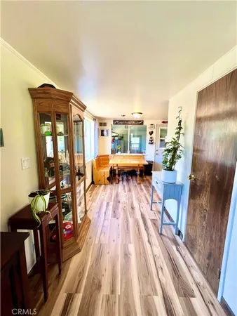 a living room with furniture fireplace and wooden floor