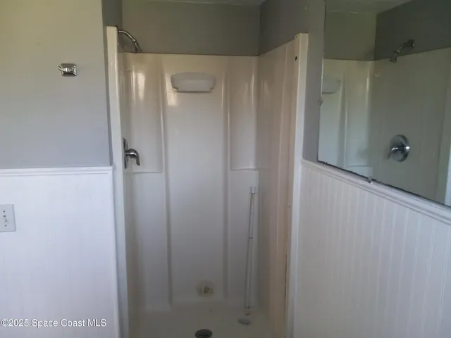 a bathroom with a toilet a sink and a window