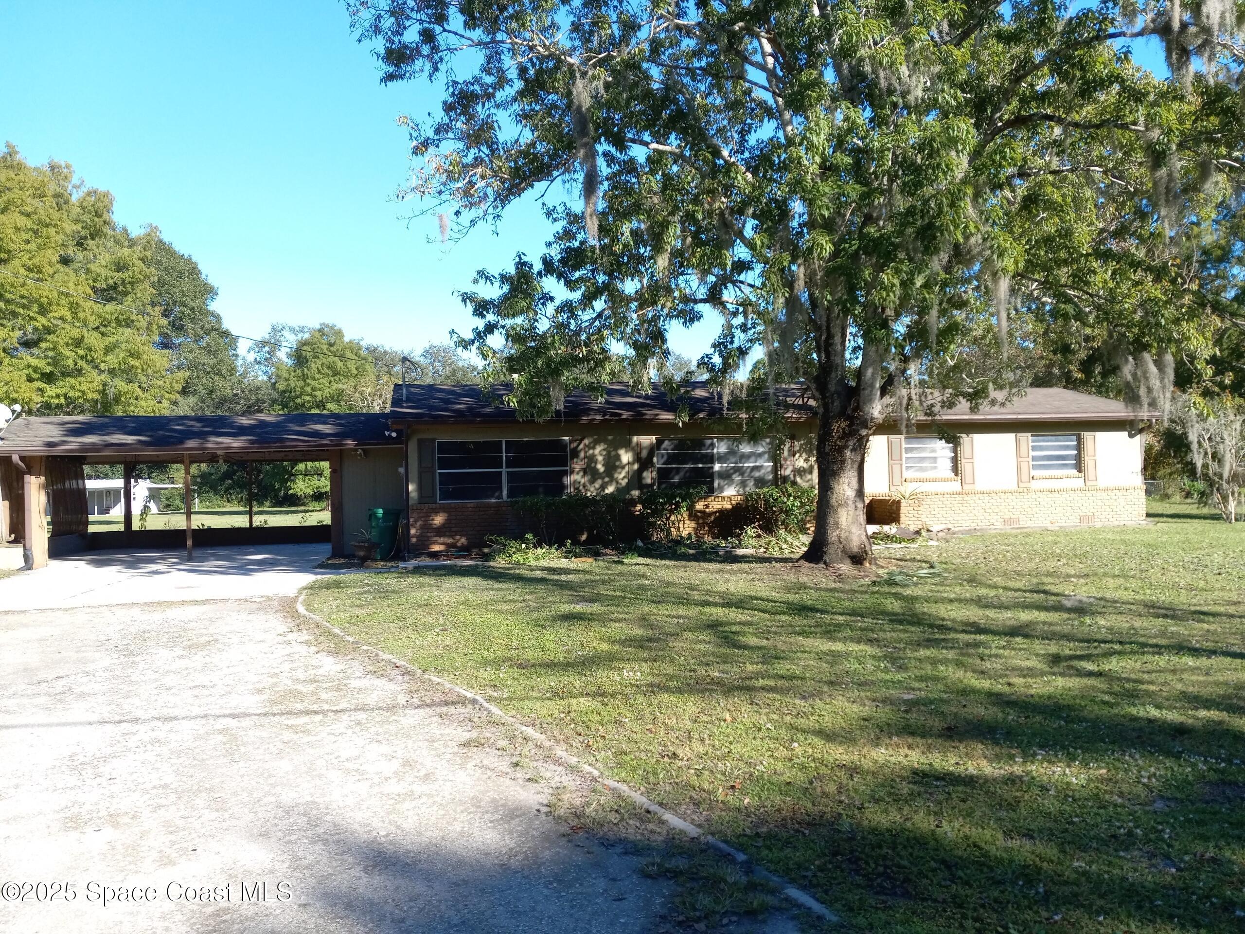 4335 Kumquat Street Cocoa, FL 32926 - Photo 21 of 21 a view of a house with a yard