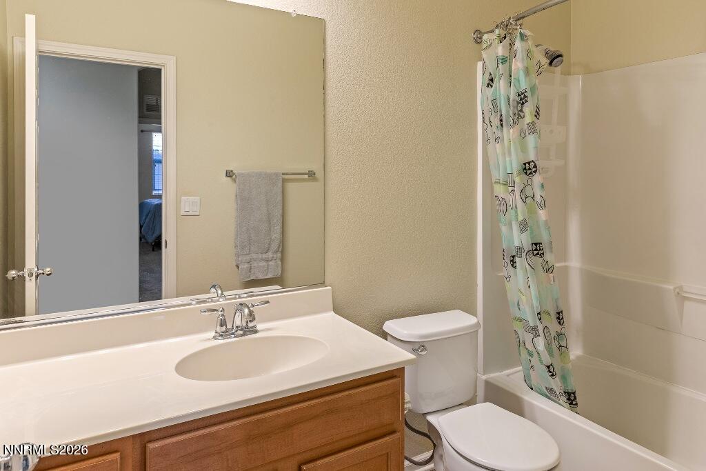 1864 Wind Ranch Road, Unit B Reno, NV 89521 - Photo 29 of 42 a bathroom with a sink toilet and shower