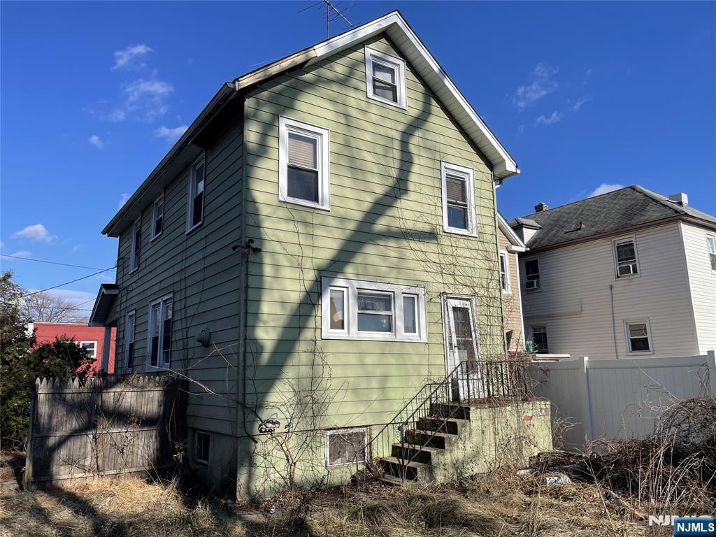 181 Berdan Place Hackensack, NJ 07601 - Photo 3 of 5 a front view of a house with a yard